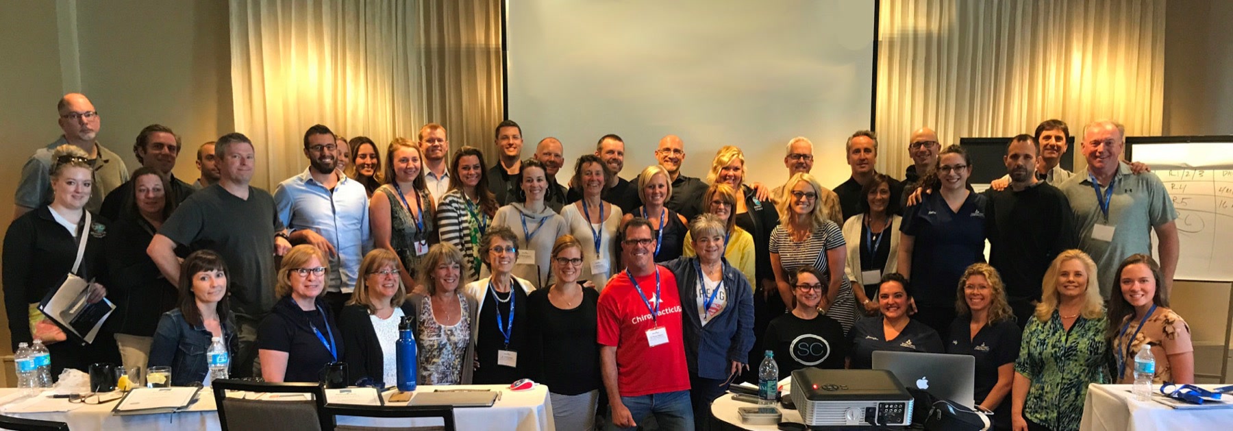 A group photo of doctors and teams at a past Remarkable Practice event